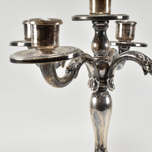 208 - A continental 800 silver five arm candelabra. The candelabra having acanthus leaf decoration to the ... 