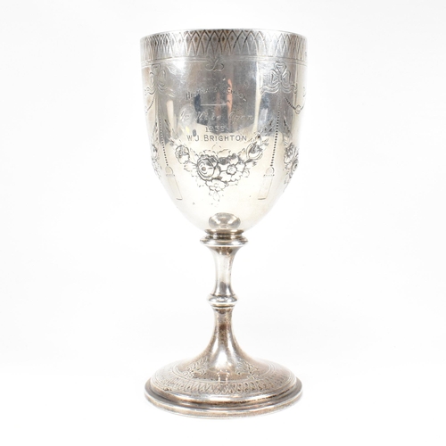 21 - A Victorian hallmarked silver goblet trophy. The goblet having a circular plinth base with baluster ... 