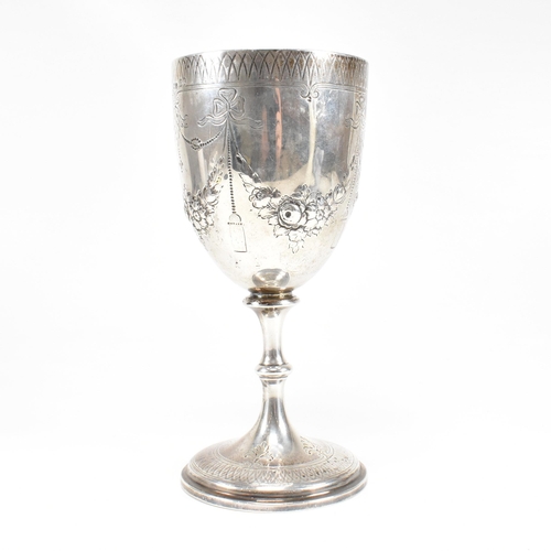 21 - A Victorian hallmarked silver goblet trophy. The goblet having a circular plinth base with baluster ... 