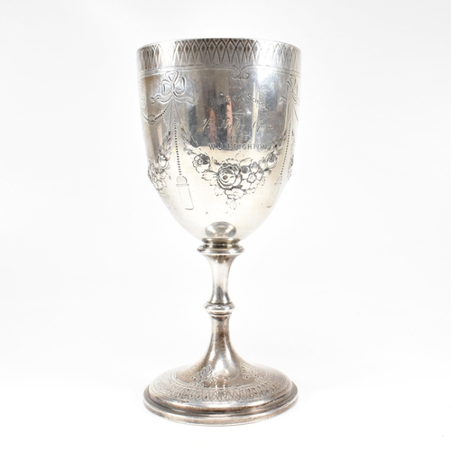 21 - A Victorian hallmarked silver goblet trophy. The goblet having a circular plinth base with baluster ... 