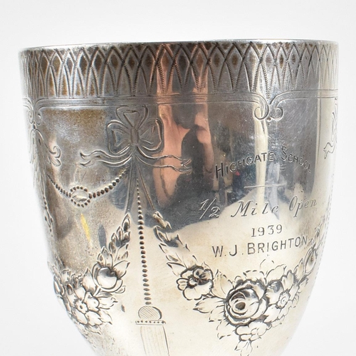 21 - A Victorian hallmarked silver goblet trophy. The goblet having a circular plinth base with baluster ... 