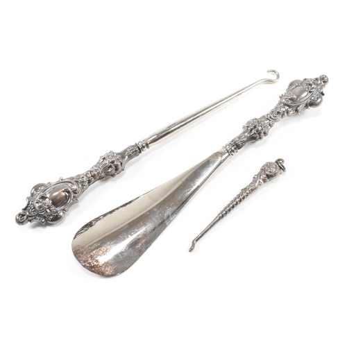 24 - An early 20th Century hallmarked silver vanity mirror and cased set of silver handled items. The lot... 