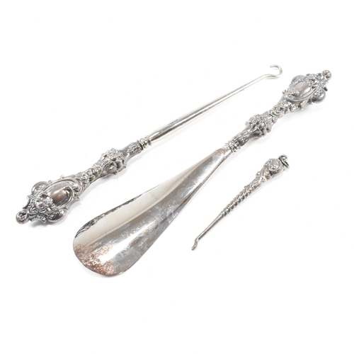 24 - An early 20th Century hallmarked silver vanity mirror and cased set of silver handled items. The lot... 