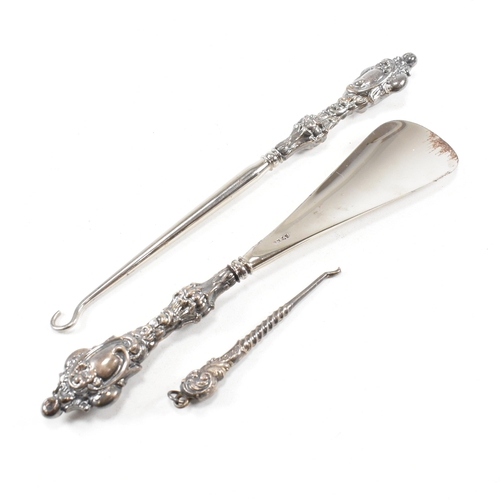 24 - An early 20th Century hallmarked silver vanity mirror and cased set of silver handled items. The lot... 