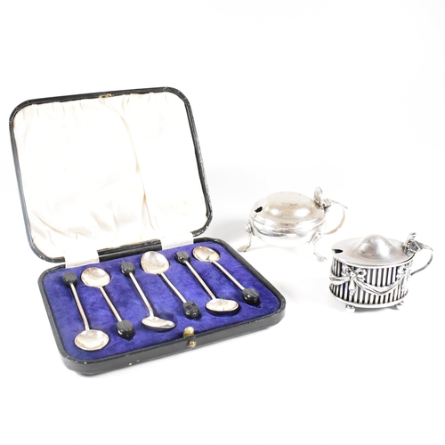 28 - A collection of hallmarked silver items.The lot to include a cased set of six coffee spoons. The tea... 