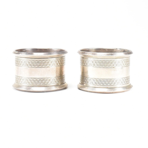 30 - Four Early 20th century hallmarked silver napkin rings. The lot to include a pair of George V hallma... 