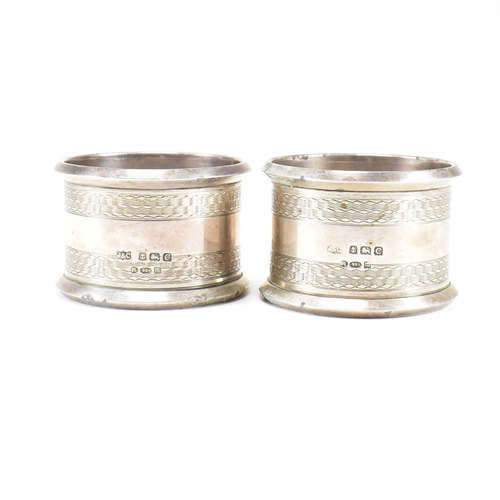 30 - Four Early 20th century hallmarked silver napkin rings. The lot to include a pair of George V hallma... 