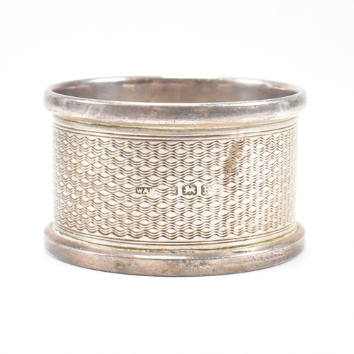 30 - Four Early 20th century hallmarked silver napkin rings. The lot to include a pair of George V hallma... 