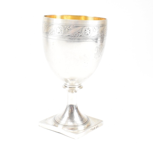 31 - A George III hallmarked silver goblet. The early 19th century goblet having a square plinth base ris... 