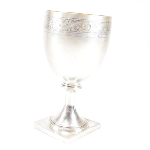 31 - A George III hallmarked silver goblet. The early 19th century goblet having a square plinth base ris... 