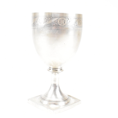 31 - A George III hallmarked silver goblet. The early 19th century goblet having a square plinth base ris... 