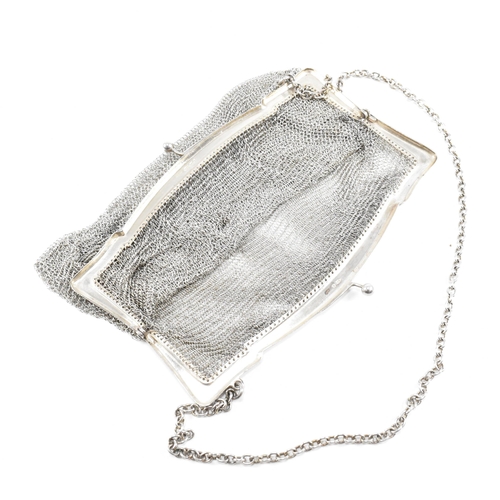 34 - George V hallmarked silver mesh bag and white metal coin purse.ÿThe bag stamped 925 with import mark... 