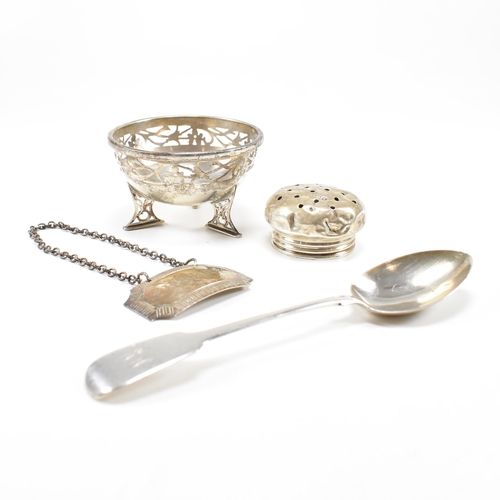 40 - A collection of hallmarked silver items. The lot to include a trinket dish. The dish being raised on... 