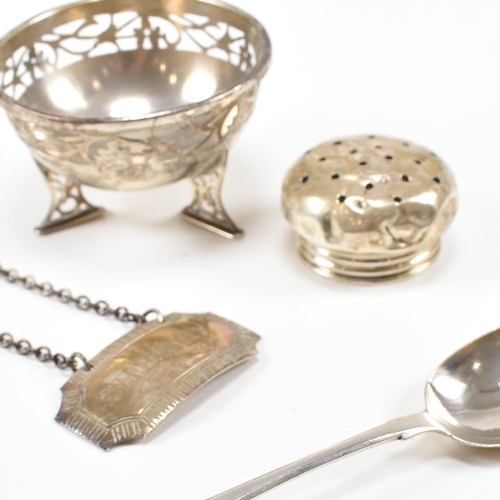 40 - A collection of hallmarked silver items. The lot to include a trinket dish. The dish being raised on... 