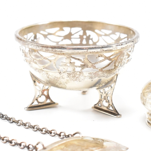 40 - A collection of hallmarked silver items. The lot to include a trinket dish. The dish being raised on... 