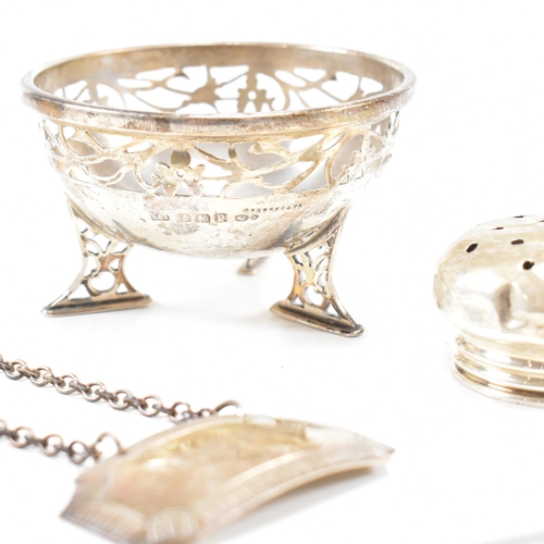 40 - A collection of hallmarked silver items. The lot to include a trinket dish. The dish being raised on... 