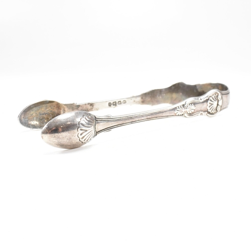 41 - One pair of Victorian and one pair of George IV hallmarked silver sugar tongs. Both tongs having mou... 