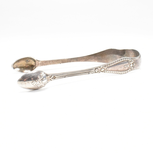 41 - One pair of Victorian and one pair of George IV hallmarked silver sugar tongs. Both tongs having mou... 