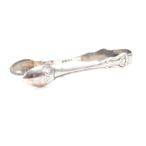 41 - One pair of Victorian and one pair of George IV hallmarked silver sugar tongs. Both tongs having mou... 