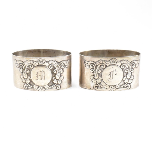 42 - Hallmarked silver napkin rings and trophy. The lot to include a pair of Edward VII silver napkin rin... 