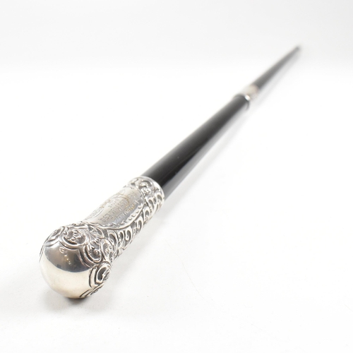 45 - A George V cased hallmarked silver and ebony conductors baton. The baton having a silverÿpommel and ... 