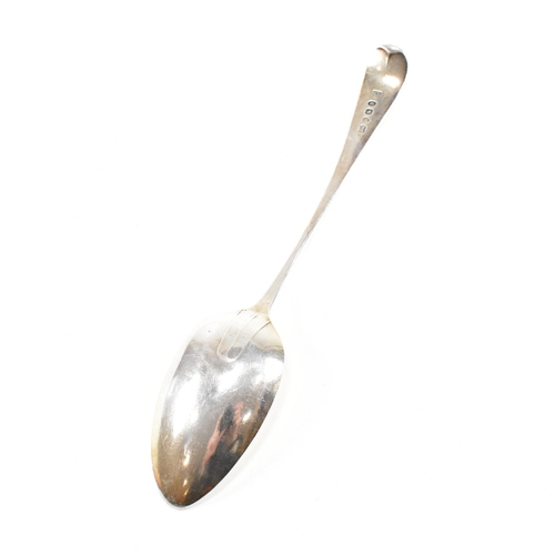 49 - A Georgian hallmarked silver serving spoon. The George Vÿspoon having a fiddle pattern decoration an... 