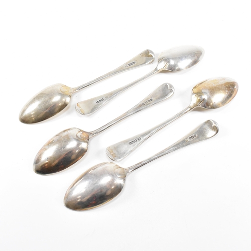 50 - A collection of five George V hallmarked silver table spoons.ÿThe five spoons having a fiddle patter... 