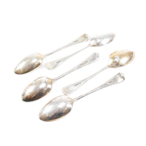 50 - A collection of five George V hallmarked silver table spoons.ÿThe five spoons having a fiddle patter... 