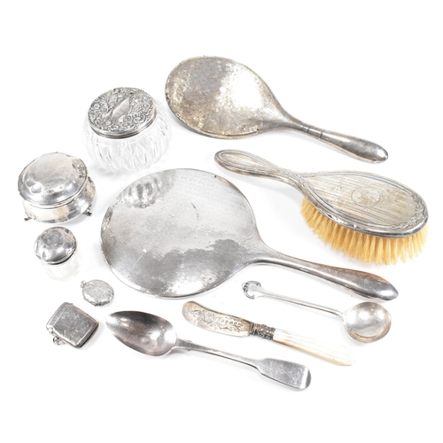 52 - A collection hallmarked silver items.ÿ The lot to include a vanity mirror, brushes, vesta case, cut ... 