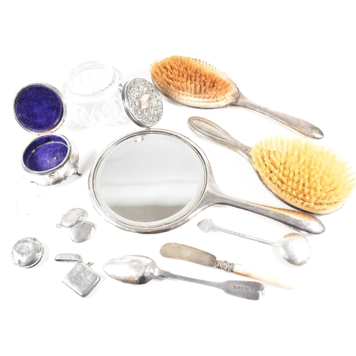 52 - A collection hallmarked silver items.ÿ The lot to include a vanity mirror, brushes, vesta case, cut ... 