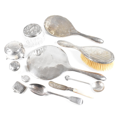 52 - A collection hallmarked silver items.ÿ The lot to include a vanity mirror, brushes, vesta case, cut ... 