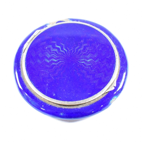 54 - A continental Austrian 925 Silver and guilloche enamel powder compact (AF). The make up compact havi... 