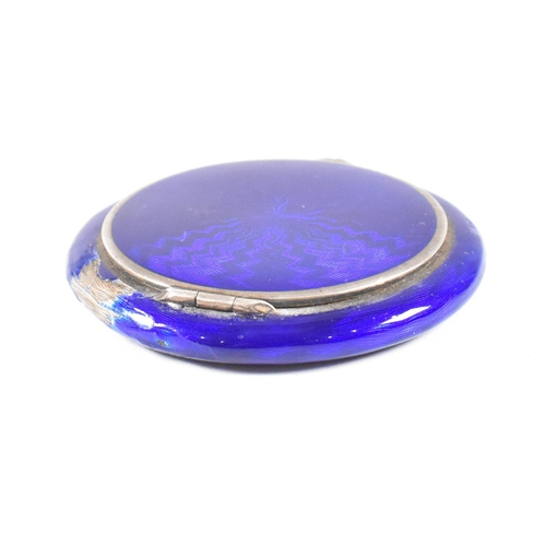 54 - A continental Austrian 925 Silver and guilloche enamel powder compact (AF). The make up compact havi... 