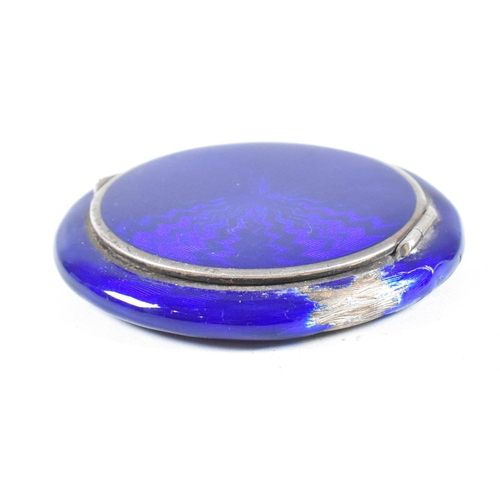 54 - A continental Austrian 925 Silver and guilloche enamel powder compact (AF). The make up compact havi... 