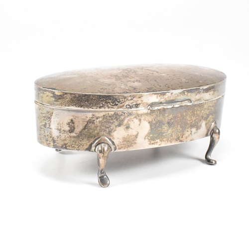 56 - A George V hallmarked silver mounted jewellery box. The trinket box having for hoof feet, rising to ... 