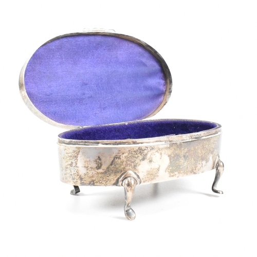 56 - A George V hallmarked silver mounted jewellery box. The trinket box having for hoof feet, rising to ... 