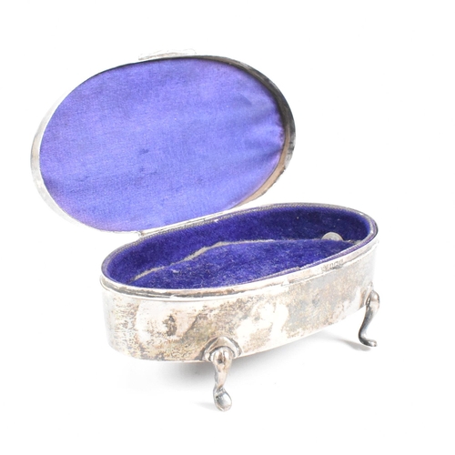 56 - A George V hallmarked silver mounted jewellery box. The trinket box having for hoof feet, rising to ... 