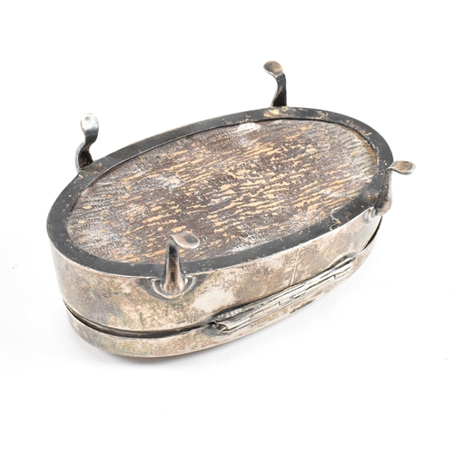 56 - A George V hallmarked silver mounted jewellery box. The trinket box having for hoof feet, rising to ... 