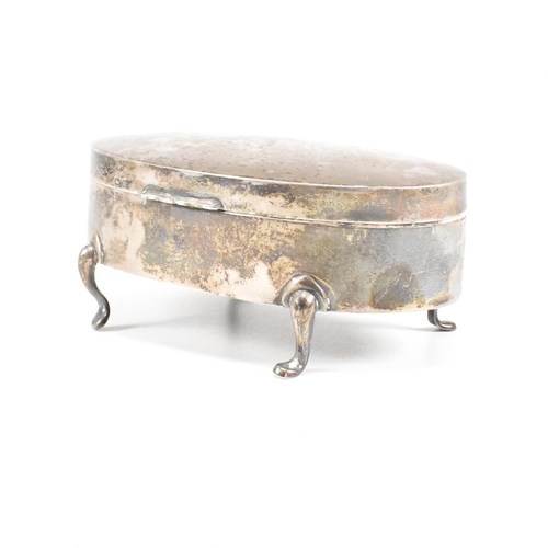 56 - A George V hallmarked silver mounted jewellery box. The trinket box having for hoof feet, rising to ... 