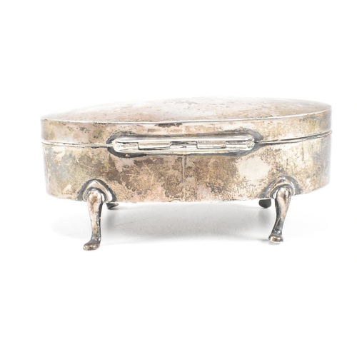 56 - A George V hallmarked silver mounted jewellery box. The trinket box having for hoof feet, rising to ... 