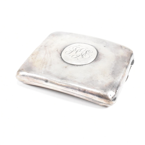 57 - A George V Hallmarked silver cigarette case. The case having a central monogrammed cartouche to fron... 