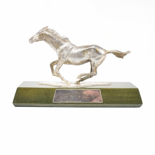 58 - A 1970s hallmarked Algernon Asprey hallmarked silver horse statue on plinth. The horse in canter mou... 