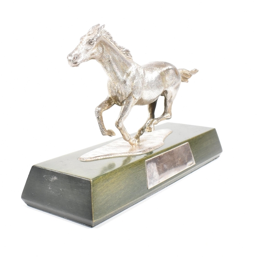 58 - A 1970s hallmarked Algernon Asprey hallmarked silver horse statue on plinth. The horse in canter mou... 