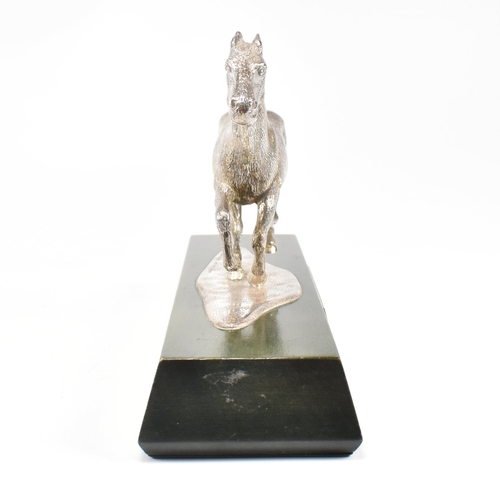 58 - A 1970s hallmarked Algernon Asprey hallmarked silver horse statue on plinth. The horse in canter mou... 