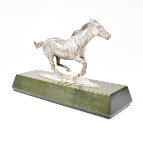 58 - A 1970s hallmarked Algernon Asprey hallmarked silver horse statue on plinth. The horse in canter mou... 