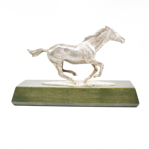 58 - A 1970s hallmarked Algernon Asprey hallmarked silver horse statue on plinth. The horse in canter mou... 