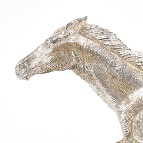 58 - A 1970s hallmarked Algernon Asprey hallmarked silver horse statue on plinth. The horse in canter mou... 