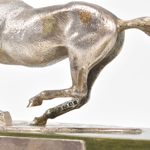 58 - A 1970s hallmarked Algernon Asprey hallmarked silver horse statue on plinth. The horse in canter mou... 