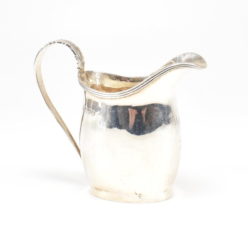 59 - An Edward VII Hallmarked silver creamer. The cream jug having an oval foot base raising to a bulbous... 