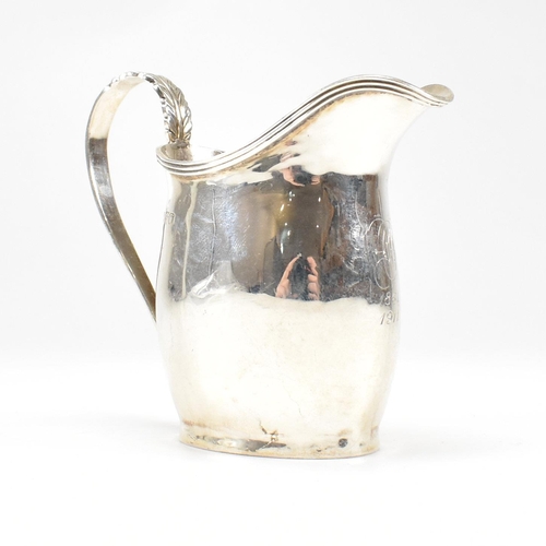 59 - An Edward VII Hallmarked silver creamer. The cream jug having an oval foot base raising to a bulbous... 